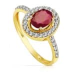 Anillo en Oro Bicolor 18K con Rubí 7 x 5 mm y Orla de Circonitas